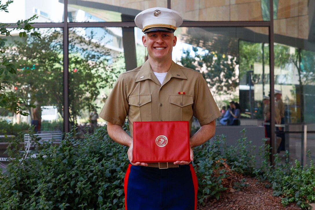 U.S. Marine Corps 1st Lt. Donald Griffith, a soon to be judge advocate, is promoted in front of Sandra Day O'Connor School of Law, Phoenix, Arizona, Aug. 27, 2024. Griffith is a 2024 Arizona State University Law School alumni. Upon passing his bar exam, he will move on to be a judge advocate. (U.S. Marine Corps photo by Sergeant Symira Bostic)