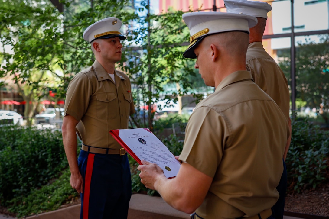 U.S. Marine Corps 1st Lt. Donald Griffith, a soon to be judge advocate, is promoted in front of Sandra Day O'Connor School of Law, Phoenix, Arizona, Aug. 27, 2024. Griffith is a 2024 Arizona State University Law School alumni. Upon passing his bar exam, he will move on to be a judge advocate. (U.S. Marine Corps photo by Sergeant Symira Bostic)