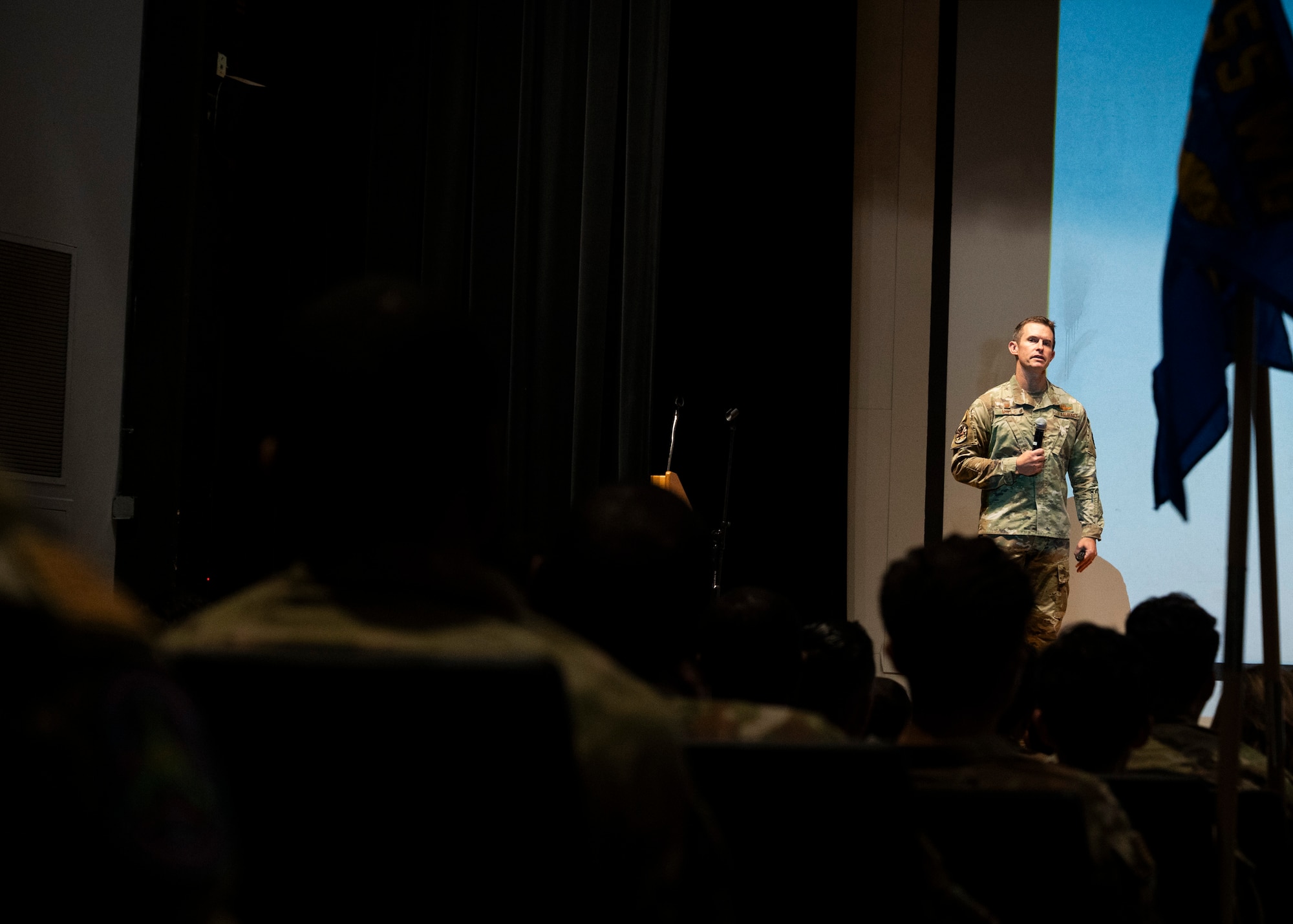 U.S. Air Force Col. Scott Mills, 355th Wing commander, answers questions during a commander's call at Davis-Monthan Air Force Base, Arizona, Sept. 6, 2024. Mills put out an anonymous quick-response code to base members to address their questions and concerns. (U.S. Air Force photo by Airman 1st Class William Finn V)