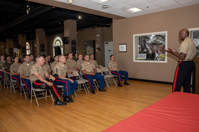 U.S. Marine Corps Brig. Gen. James A Ryan II, the commanding general of Marine Corps Recruit Depot San Diego, left, congratulates officers with the Marine Corps Recruiting Command who are being recognized for their outstanding performance and diligent efforts of the Western Recruiting Region Recruiting Offensive “Operation Overlord” at MCRD San Diego, California, Aug. 1, 2024. Operation Overlord was a summer recruiting offensive held to foster competition amongst the recruiting force and increase productivity, while creating a contracting momentum for fiscal year 2025. U.S. Marine Corps Maj. Gen. WIlliam Bowers, the commanding general of Marine Corps Recruiting Command, left, Sgt. Maj. Allen Goodyear, command senior enlisted leader with Marine Corps Recruiting Command, center left, also attended the Operation Overlord ceremony. (U.S. Marine Corps photo by Cpl. Sarah M. Grawcock)