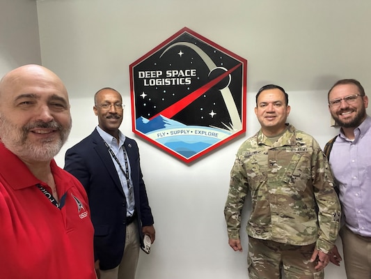 Col. Shane Cuellar, SPACECOM/J4, Jondavid DuVall, SSC/S4L, and Mr. Patrick Wentzel, SPACECOM/J473 with Mr. Herman Moyer, NASA Deep Space Logistics.