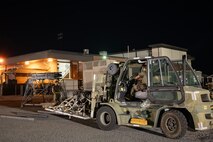 An Airman prepares cargo.