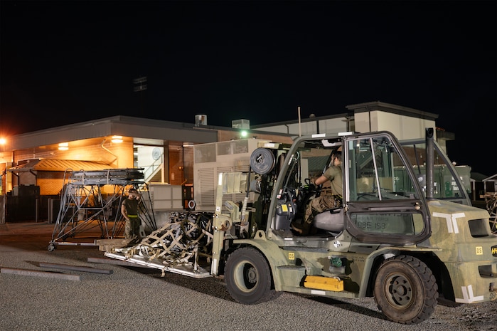 An Airman prepares cargo.