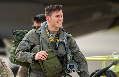 A pilot steps away from their aircraft after landing