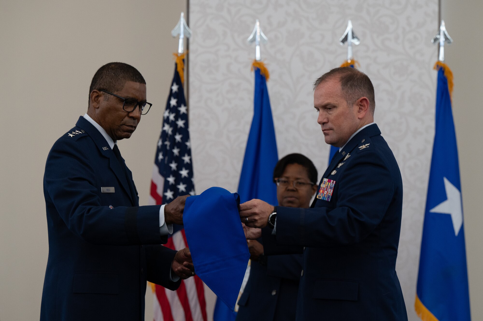 Reed and Arrington unveil the guidon.