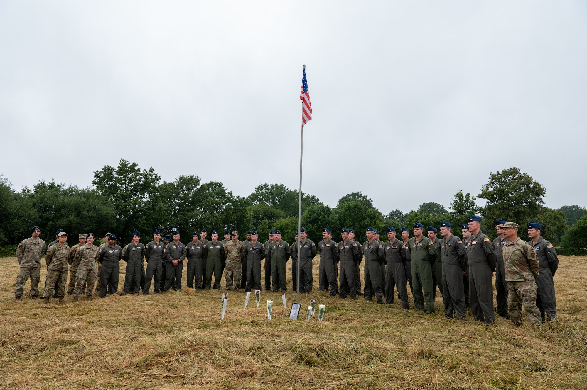 Airmen from the 514th Air Mobility Wing, Joint Base McGuire-Dix-Lakehurst, N.J., join the mayor and other residents of Lonlay L'Abbaye, France, on Aug. 9, 2024, to commemorate the 80th anniversary of the fatal B-17 "Chowhound" crash.