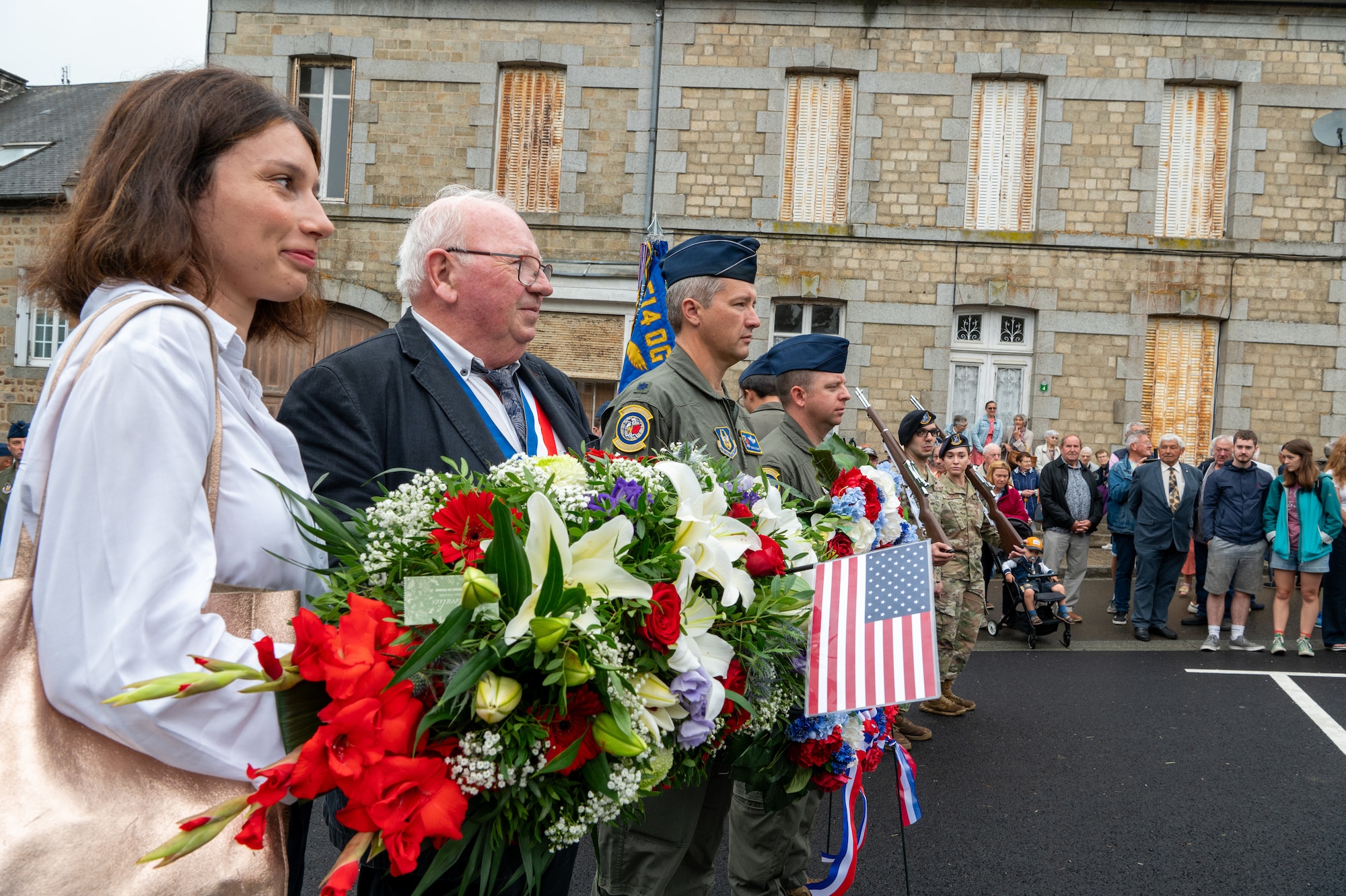 Airmen from the 514th Air Mobility Wing, Joint Base McGuire-Dix-Lakehurst, N.J., join the mayor and other residents of Lonlay L'Abbaye, France, on Aug. 9, 2024, to commemorate the 80th anniversary of the fatal B-17 "Chowhound" crash.