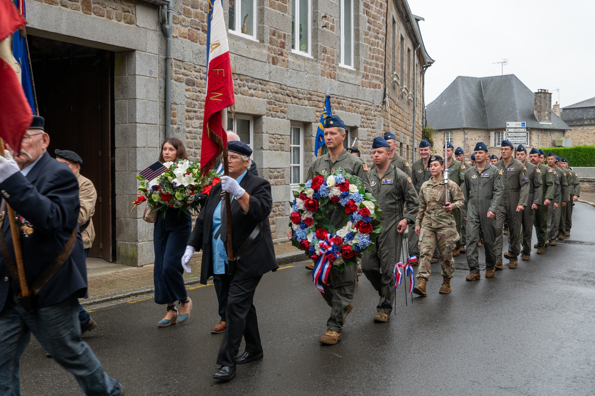 Airmen from the 514th Air Mobility Wing, Joint Base McGuire-Dix-Lakehurst, N.J., join the mayor and other residents of Lonlay L'Abbaye, France, on Aug. 9, 2024, to commemorate the 80th anniversary of the fatal B-17 "Chowhound" crash.