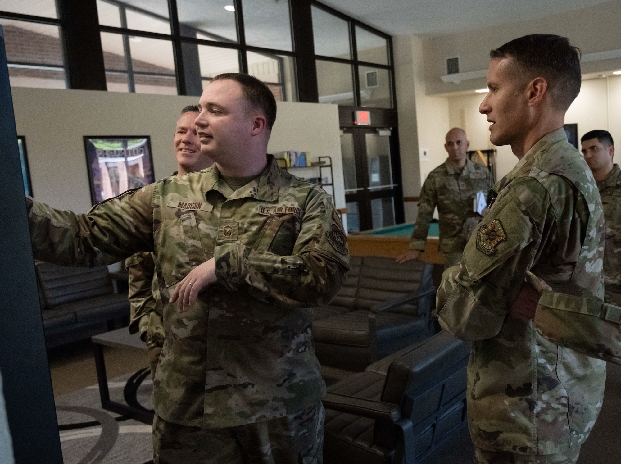 U.S. Airmen look at equipment
