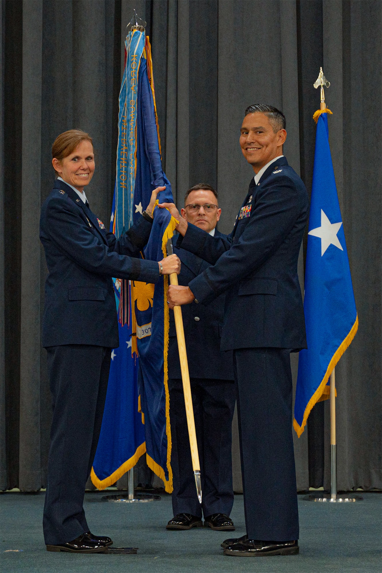 Airmen hold flag