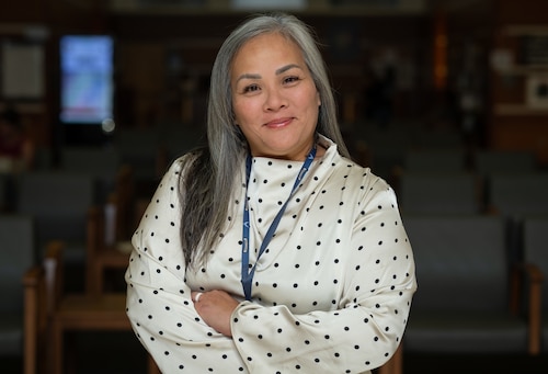 Brenda Manzana, 36th Medical Group clinical quality risk accreditation and credential privileging specialist, poses for a photo at Andersen Air Force Base, Guam, Sept. 6, 2024. Manzana is one of the first Federal Employees to sign up for Andersen's new peer-to-peer resiliency initiative, the Sentinel Program. Manzana said that having civilian counterparts as Sentinels clears the air for Airmen to be able to find more types of mentors, different viewpoints for advice and a steady source of continuity due to Andersen's common two-year commitment for Airmen. (U.S. Air Force photo by Staff Sgt. Pedro Tenorio)