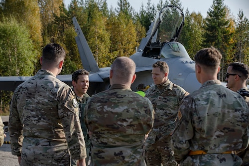 A Finish Air Force Colonel speaks to a group of U.S. Air Force maintainers