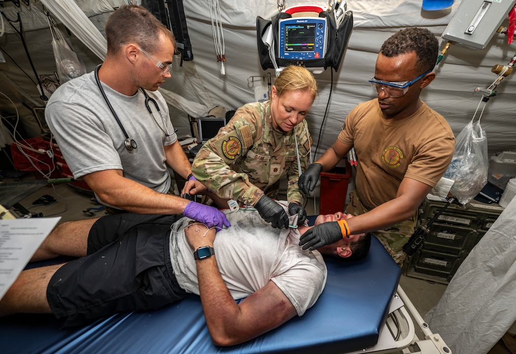 U.S. Air Force Airmen assigned to the 378th Expeditionary Medical Squadron provide care to a simulated patient during a mass casualty exercise at an undisclosed location within the U.S. Central Command area of responsibility, Aug. 24, 2024. The exercise provided 378 EMDS the opportunity to activate the medical contingency response plan to integrate alongside external agencies while providing direct care to simulated patients. (U.S. Air Force photo)