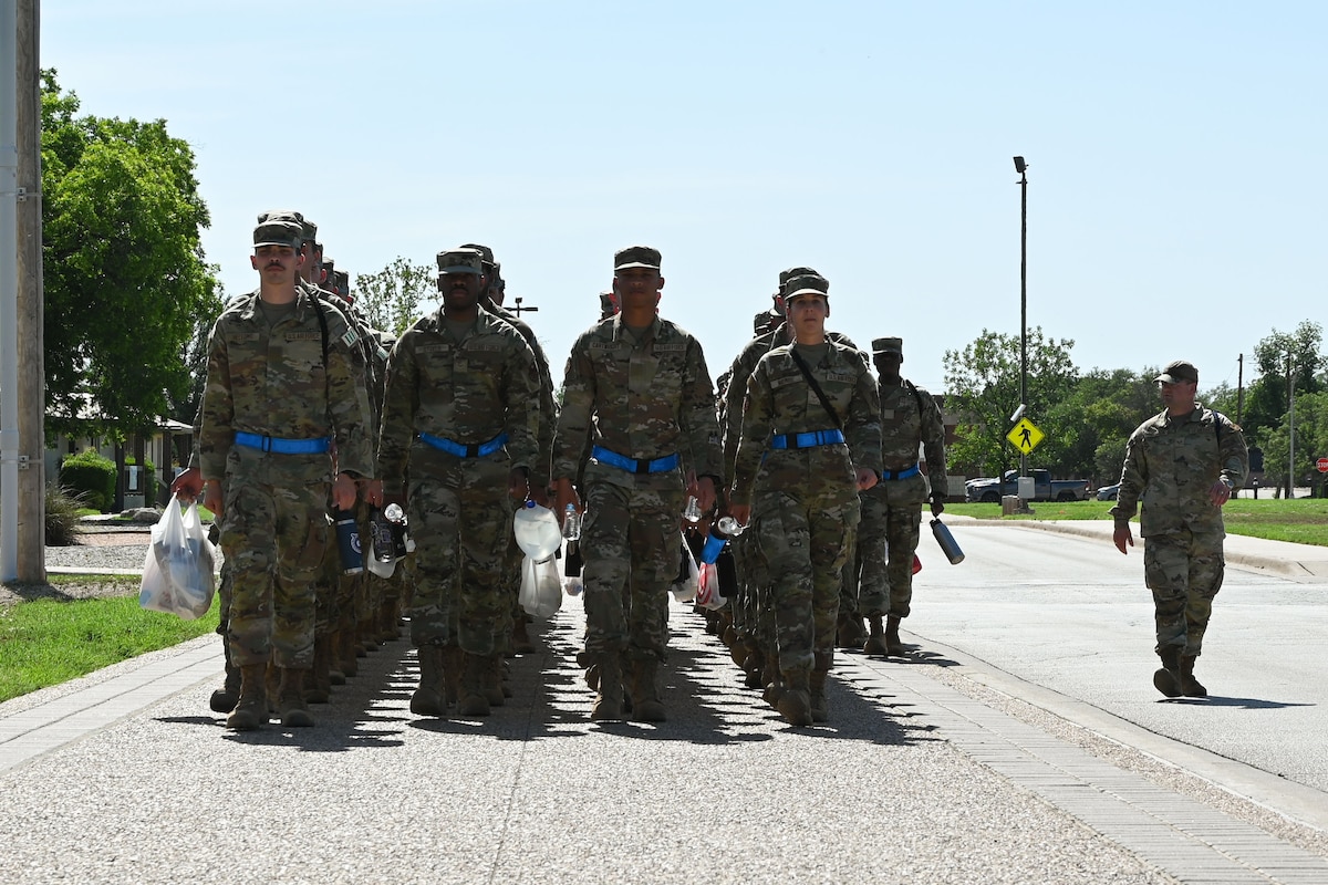 U.S. Air Force Airmen assigned to the 315th Training Squadron are marched back to their squadron by their Military Training Leader after a day of intelligence classes at Goodfellow Air Force Base, Texas, May 8, 2024. The 315th TRS is one of Goodfellow’s squadrons responsible for training the Air Force’s future intelligence warriors. (U.S. Air Force photo by Airman 1st Brian Lummus)