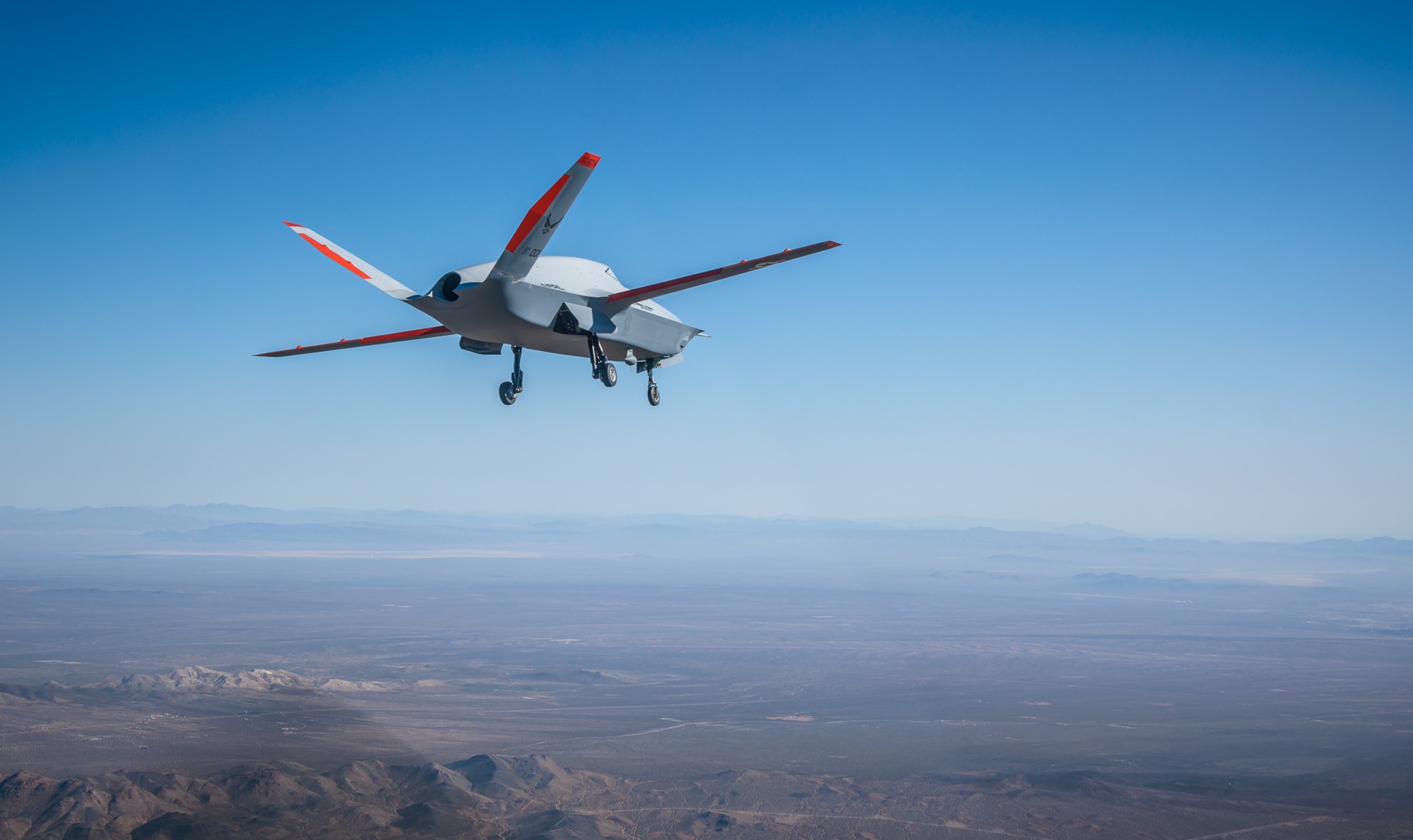 The Air Force Research Laboratory, or AFRL’s, XQ-67A Off Board Sensing Station uncrewed air vehicle, designed and built by General Atomics, takes its maiden flight Feb. 28, 2024, from Gray Butte Field Airport in Palmdale, California. The XQ-67A’s first flight was made possible due in large part to Low Cost Attritable Aircraft Platform Sharing, or LCAAPS, which AFRL will showcase at its “Engine to Accelerate” booths at the 2024 Air and Space Forces Association’s Air, Space and Cyber Conference Sept. 16-18, 2024, in National Harbor, Maryland. LCAAPS leverages best practices of consumer industries to rapidly develop and build autonomous collaborative platforms in large numbers, with the goal of achieving affordable mass by streamlining the design and development process. The XQ-67A, the first of a second generation of autonomous collaborative platforms, proves the feasibility of this approach and demonstrates how wholly new acquisition processes can deliver capability to the warfighter more quickly and efficiently. (Courtesy photo)