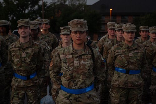 U.S. Air Force Airmen assigned to the 315th Training Squadron stand at parade rest during morning formation outside the Western Winds dining facility at Goodfellow Air Force Base, Texas, July 29, 2024. Students assigned to the 315th TRS hold open ranks regularly to ensure their uniforms and appearance are up to standards. (U.S. Air Force photo by Airman 1st Class Brian Lummus)