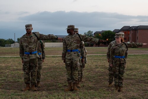U.S. Air Force Airmen student leaders assigned to the 315th receive their black aiguillettes during morning formation outside the Western Winds dining facility at Goodfellow Air Force Base, Texas, July 29, 2024. Black ropes are selected to lead as members of the Student Drill Team and Special Activities Team. (U.S. Air Force photo by Airman 1st Class Brian Lummus)