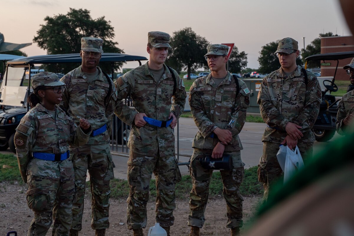 U.S. Air Force Airmen student leaders assigned to 315th Training Squadron assess their performance after marching to class at Goodfellow Air Force Base, Texas, July 29, 2024. The 315th TRS Airmen student leaders gather after every formation to reflect on their presentation and share concerns with Military Training Leaders (U.S. Air Force photo by Airman 1st Class Brian Lummus)