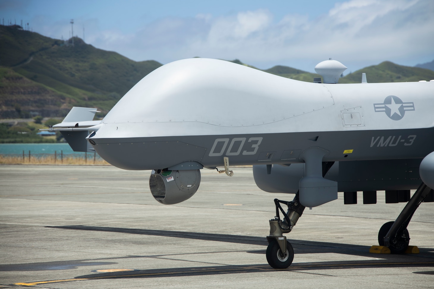 A U.S. Marine Corps MQ-9A MUX/MALE assigned to Marine Unmanned Aerial Vehicle Squadron (VMU) 3, Marine Aircraft Group 24, 1st Marine Aircraft Wing completes preflight checklist during the first Satellite Communications (SATCOM) Launch and Recovery (SLR) mission at Marine Corps Air Station Kaneohe Bay, Hawaii, June 20. SLR minimizes logistical constraints, enables operations from short airfields over vast distances, and supports the flexibility required for modern expeditionary operations. VMU-3's successful SLR demonstration emphasized its pivotal role in advancing Marine Corps capabilities in reconnaissance, surveillance, and target acquisition missions across the Indo-Pacific region.