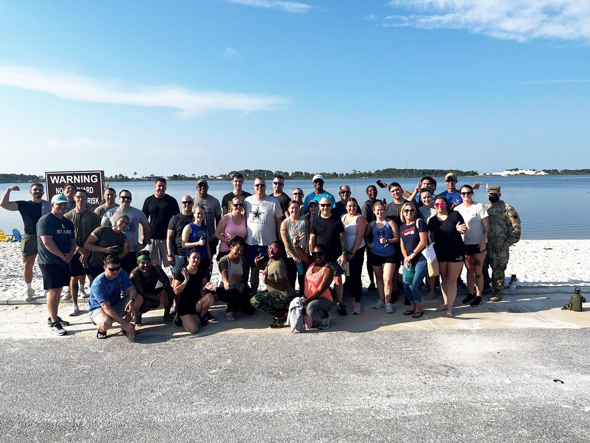 In August 2024, members of the 28th Intelligence Squadron (IS) participated in “PT in the Sand” along with Col. Philip Warlick, 655th Intelligence, Surveillance and Reconnaissance (ISR) Wing commander, and Chief Master Sgt. Aaron Doss, wing command chief, during their visit to the squadron at Hurlburt Field, Fla. Squadron activities such as this foster cohesion and morale, promoting both social and physical resiliency. (Courtesy Photo)
