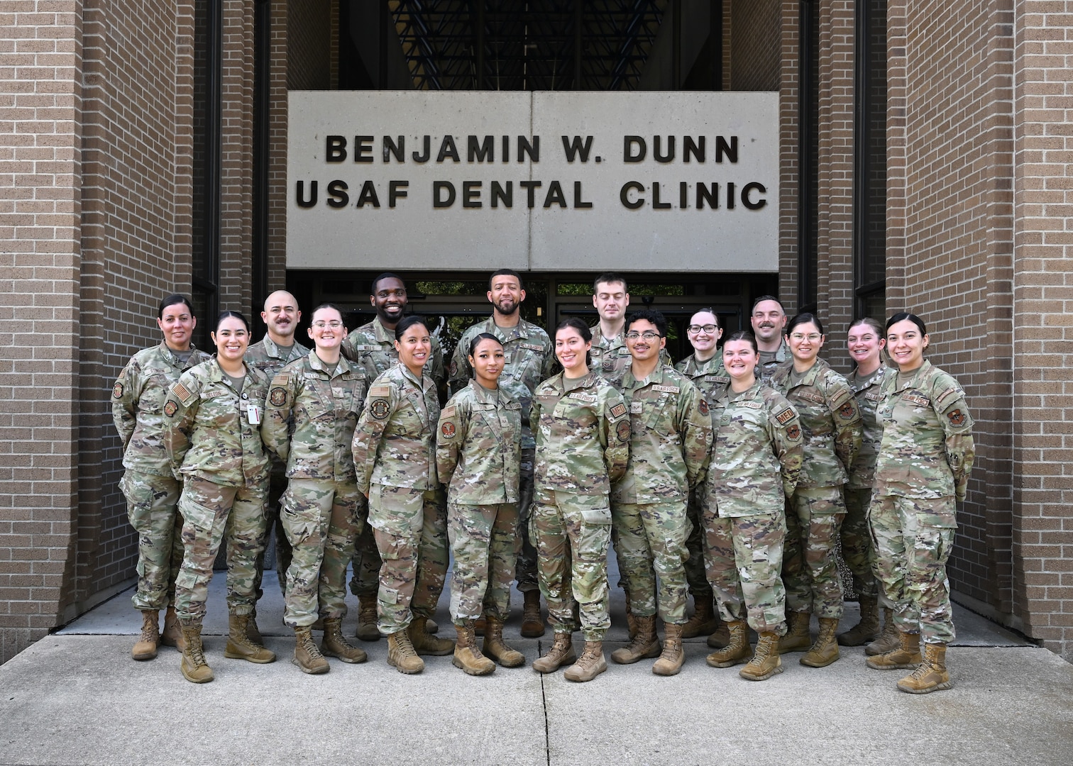 Students and instructors from the Air Force Oral Hygiene Course at Joint Base San Antonio-Lackland, Texas, pose for a group photo in front of the Benjamin W. Dunn USAF Dental Clinic on Sept. 6, 2024.