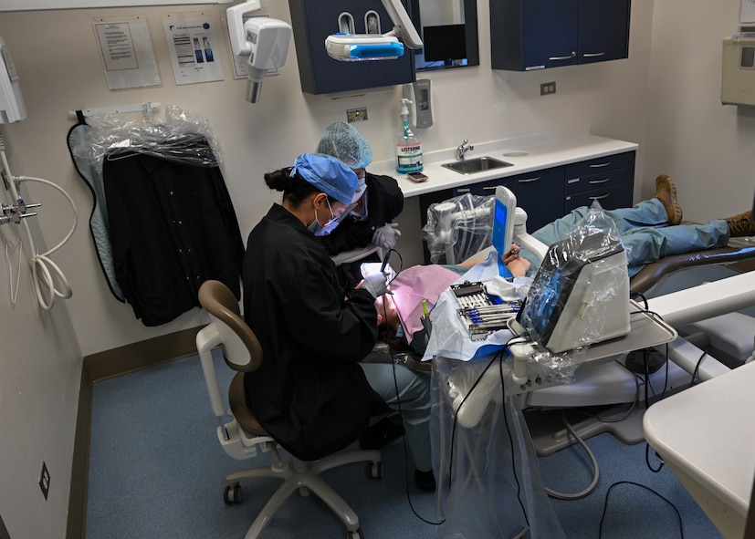 Students at the Air Force Oral Hygiene Course at Joint Base San Antonio-Lackland, Texas, perform dental procedures on a patient during the hands-on training phase at Dunn Dental Clinic on Joint Base San Antonio-Lackland, Texas Aug 28, 2024.