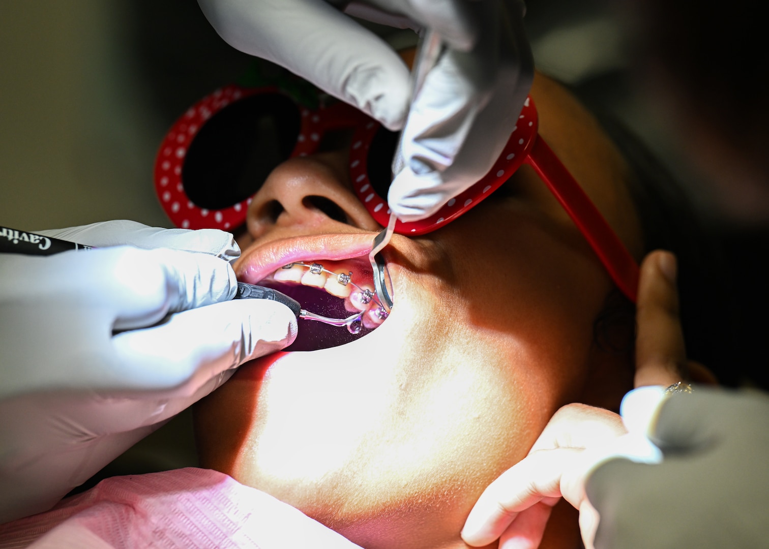 A student at the Air Force Oral Hygiene Course at Joint Base San Antonio-Lackland, Texas, performs a dental cleaning on a patient during the hands-on training phase at Dunn Dental Clinic on Joint Base San Antonio-Lackland, Texas Aug 28, 2024.