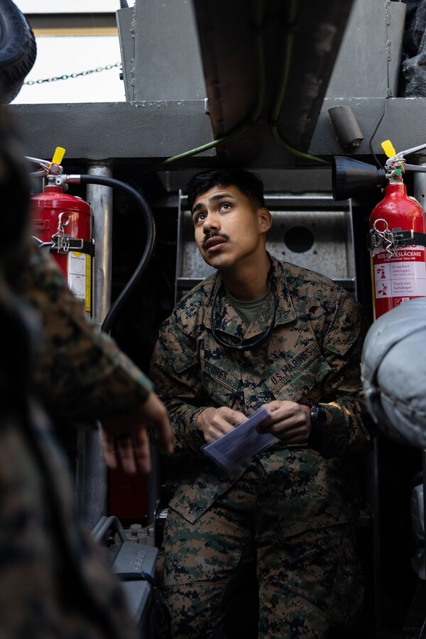 U.S. Marine Corps Lance Cpl. Israel Flores, assault amphibious vehicle crewmember, conducts a prestart checklist on a CB90 combat boat at Berga Naval Base, Sweden, Aug. 29, 2024. Marines assigned to 4th Assault Amphibian Battalion, 4th Marine Division, Marine Forces Reserve, are deployed for training in support of Exercise Archipelago Endeavor, an annual integrated, Swedish Armed Forces-led exercise that increases operational capabilities between U.S. Marines and Swedish forces. (U.S. Marine Corps photo by Sgt. Scott Jenkins)