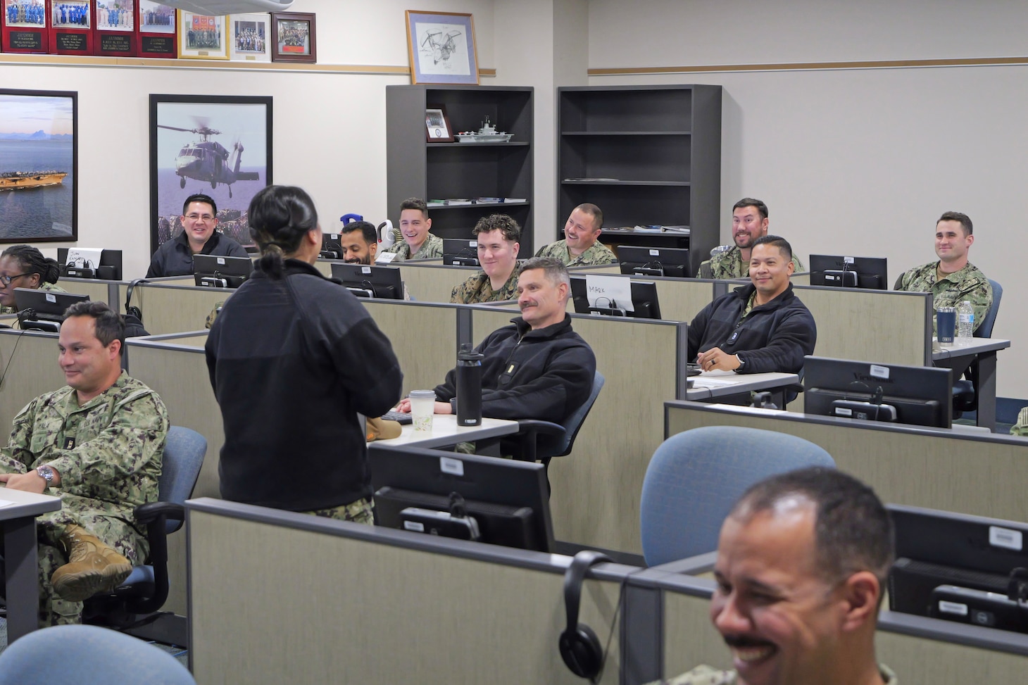 Joint Aviation Supply and Maintenance Material Management (JASMMM) instructor LSC Carla Palad provides students details about their upcoming group assignment.