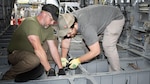 Fleet Readiness Center East (FRCE) aircraft mechanics Brian Hagopian, left, and Jonathan McAlonan, right, perform maintenance on a CH-53E Super Stallion at the depot. FRCE recently received the 2023 Chief of Naval Operations Shore Safety Award in the Large Industrial Activity category for the third time due to its commitment to safety and occupational health excellence. The depot’s safety culture, which strictly enforces the use of proper personal protective equipment, was a contributing factor to the win.