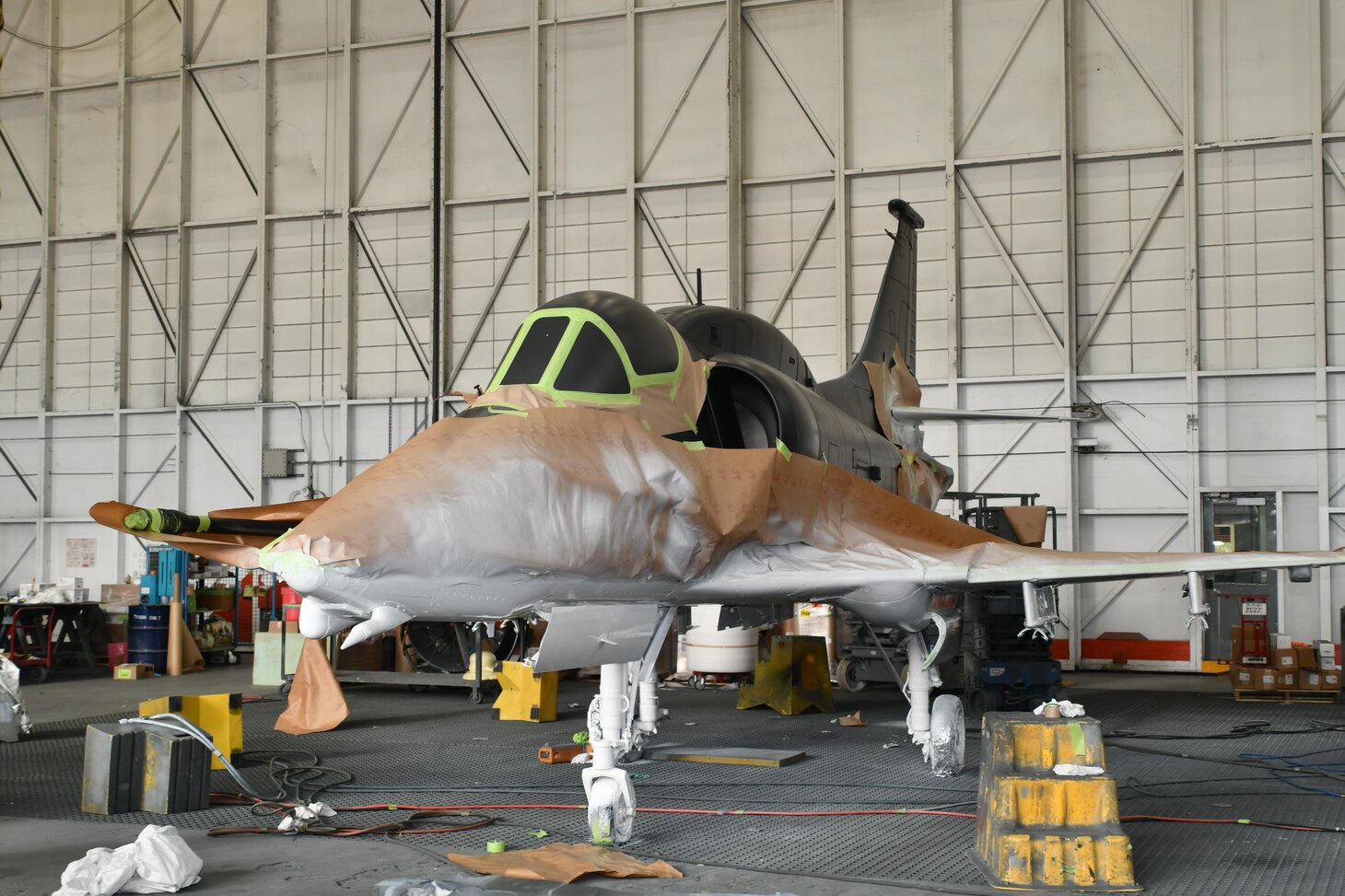 Fleet Readiness Center East Aircraft Paint Shop artisans apply the first coats of paint to the retired Douglas A-4M Skyhawk. The aircraft will serve as a historical display onboard Marine Corps Air Station Cherry Point, North Carolina.