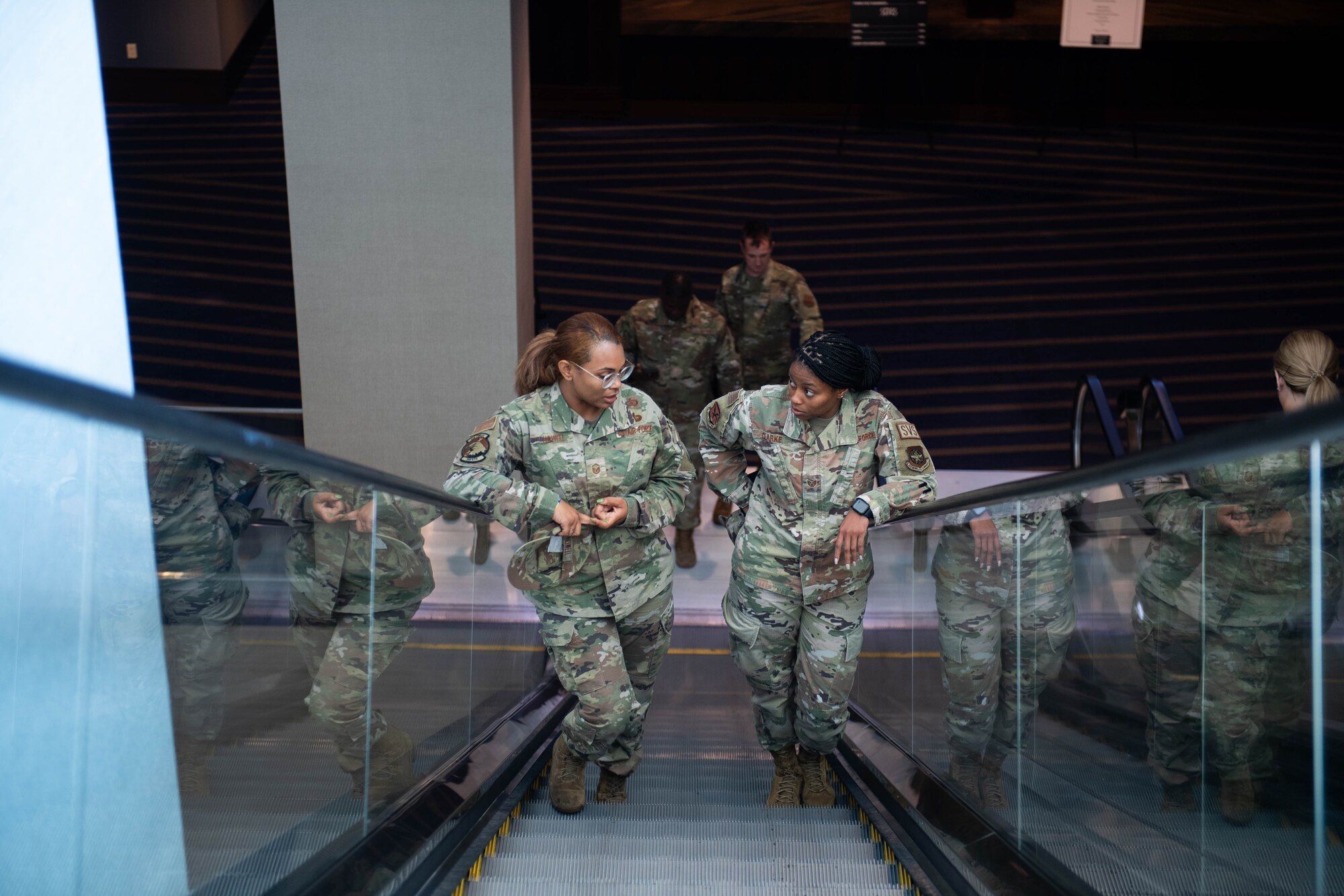 U.S. Air Force Master Sgt. Brittany Nowell, 436th Airlift Wing Wing Staff Agencies unit deployment manager, and Staff Sgt. Sha’Nesha Clarke, 436th Airlift Wing senior executive assistant to command chief, discuss professional development during the 2024 Air Force Sergeants Association Summit at Houston, Texas, Aug. 12, 2024. The 2024 AFSA Summit is an international convention and professional development symposium. Attendees received professional education and development learning opportunities from senior leaders around the U.S. military. (U.S. Air Force photo by Tech. Sgt. J.D. Strong II)