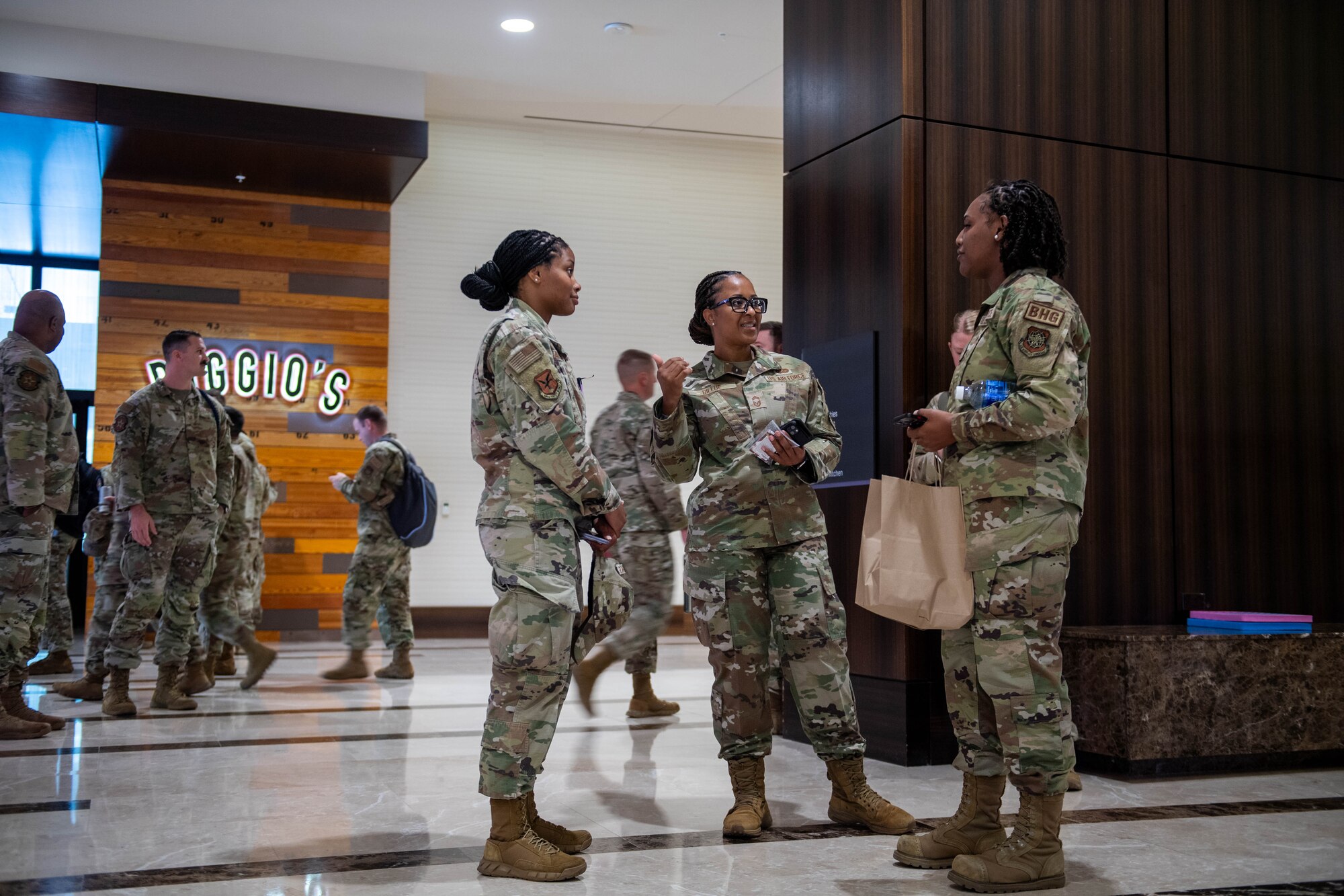 U.S. Air Force Chief Master Sgt. Katina Billue, center, 436th Force Support Squadron senior enlisted leader, discusses professional develop with Staff Sgt. Sha’Nesha Clarke, 436th Airlift Wing senior executive assistant to command chief, and Airman 1st Class Shanelle King, Dover Air Force Base Honor Guard, during the 2024 Air Force Sergeants Association Summit at Houston, Texas, Aug. 12, 2024. The 2024 AFSA Summit is an international convention and professional development symposium. Attendees received professional education and development learning opportunities from senior leaders around the U.S. military. (U.S. Air Force photo by Tech. Sgt. J.D. Strong II)