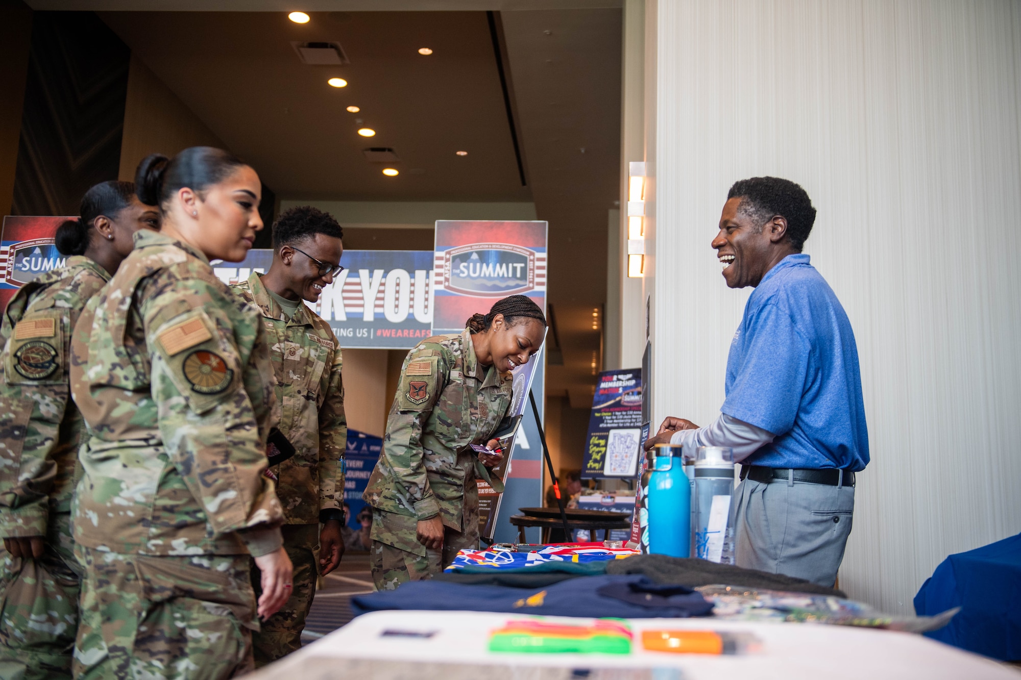 U.S. Air Force Chief Master Sgt. Carolyn Russell, 436th Airlift Wing command chief, visits a vendor during the 2024 Air Force Sergeants Association Summit at Houston, Texas, Aug. 13, 2024. The 2024 AFSA Summit is an international convention and professional development symposium. Attendees received professional education and development learning opportunities from senior leaders around the U.S. military. (U.S. Air Force photo by Tech. Sgt. J.D. Strong II)