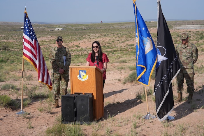 Stephanie Eddy, nuclear deterrence portfolio lead for the Air Force Research Laboratory, or AFRL’s, Nuclear Mission branch, speaks during a groundbreaking ceremony July 29, 2024, at Kirtland Air Force Base, N.M. The ceremony commenced construction for a Re-Entry Vehicle Integration Laboratory, or REVIL, that will serve AFRL’s Nuclear Mission branch and provide lab space for integrating test units for next-generation nuclear research and technology. (U.S. Air Force photo / Jessie Perkins)