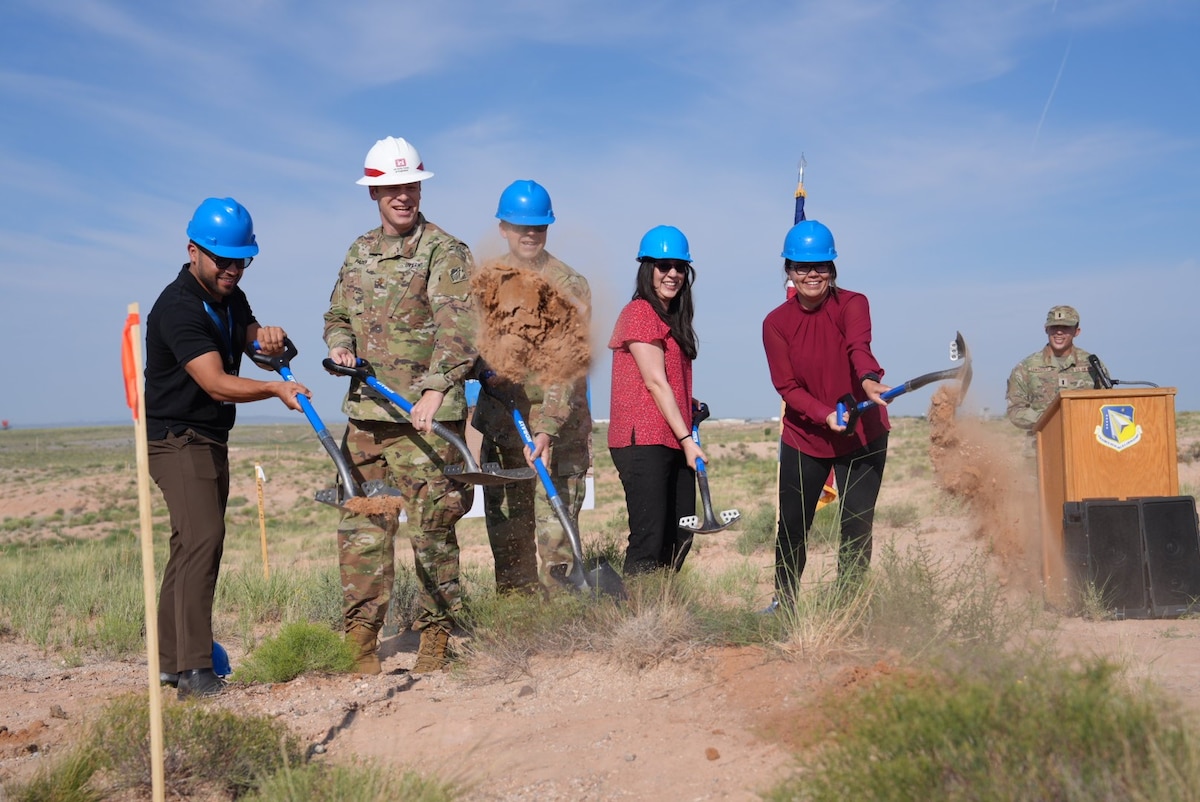 From left: Frank Garcia, CEO, Perikin Enterprises LLC; U.S. Space Force Col. Jeremy Raley, director of the Space Vehicles Directorate, Air Force Research Laboratory, or AFRL; U.S. Army Maj. Jerard Paden, deputy district commander, U.S. Army Corps of Engineers, South Pacific Division, Albuquerque District; Stephanie Eddy, nuclear deterrence portfolio lead for the Nuclear Mission branch, AFRL; and Maria Mendoza, chief, Facilities Management section, AFRL, break ground during a ceremony, July 29, 2024, at Kirtland Air Force Base, N.M. The groundbreaking marked the commencement of construction for the Re-Entry Vehicle Integration Laboratory, or REVIL, that will serve AFRL’s Nuclear Mission branch and provide a state-of-the-art lab space for integrating test units for next-generation nuclear research and technology. (U.S. Air Force photo /Jessie Perkins)
