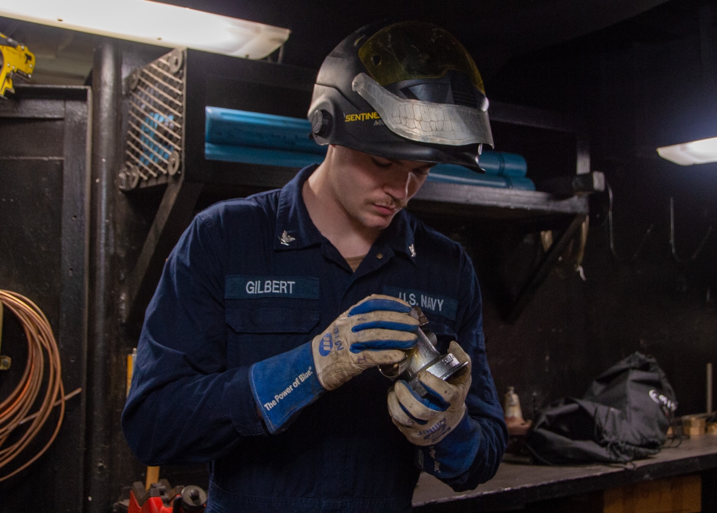 230927-N-JO823-1177 YOKOSUKA, Japan (Sept. 27, 2023) Hull Maintenance Technician 3rd Class Austin Gilbert, from Buda, Texas, adjusts piping in the weld shop of the U.S. Navy’s only forward-deployed aircraft carrier, USS Ronald Reagan (CVN 76), while in-port Commander, Fleet Activities Yokosuka, Japan, Sept. 27, 2023. Ronald Reagan, the flagship of Carrier Strike Group 5, provides a combat-ready force that protects and defends the United States, and supports alliances, partnerships and collective maritime interests in the Indo-Pacific region.