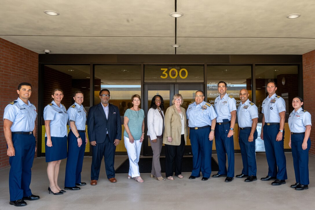 Coast Guard members assigned to Pacific Area command and Sector Los Angeles-Long Beach speak to Jane C. Conoley, California State University Long Beach president, during a memorandum of understanding ceremony Sept. 5, 2024, for the College Student Pre-Commissioning Initiative scholarship program. The memorandum of understanding outlines the university as a member of the Coast Guard's Minority-Serving Institution partnership program. (U.S. Coast Guard photo by Petty Officer 1st Class Loumania Stewart)