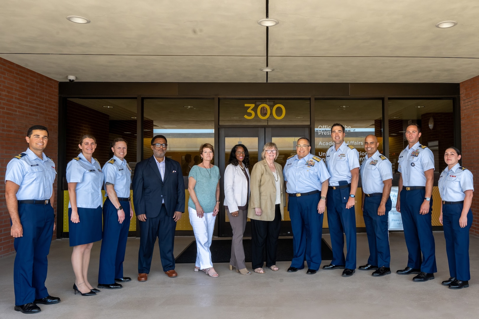 Coast Guard members assigned to Pacific Area command and Sector Los Angeles-Long Beach speak to Jane C. Conoley, California State University Long Beach president during a memorandum of agreement ceremony for the College Student Pre-Commissioning Initiative scholarship program, Sept. 5, 2024. The memorandum of agreement outlines the university as a member of the Coast Guard's Minority-Serving Institution partnership program. (U.S. Coast Guard photo by Petty Officer 1st Class Loumania Stewart)