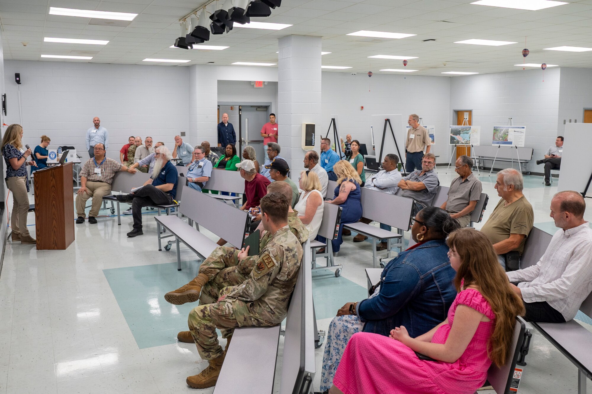 A group shot of community members in the audience.