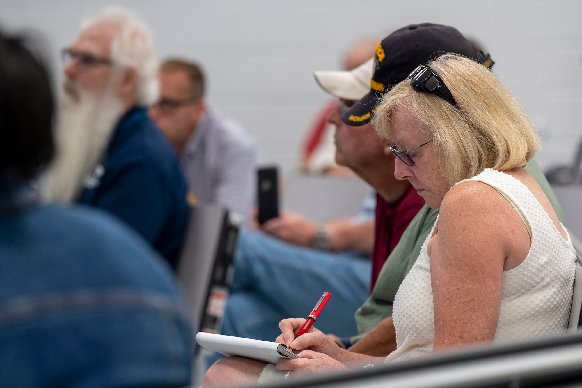 A woman writes notes.