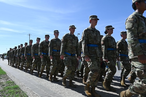 U.S. Air Force Airmen assigned to the 315th Training Squadron march back to their squadron after a day of intelligence classes at Goodfellow Air Force Base, Texas, May 8, 2024. The 315th TRS’s mission is to train, educate and inspire the future intelligence, surveillance and reconnaissance warriors. (U.S. Air Force photo by Airman 1st Brian Lummus)