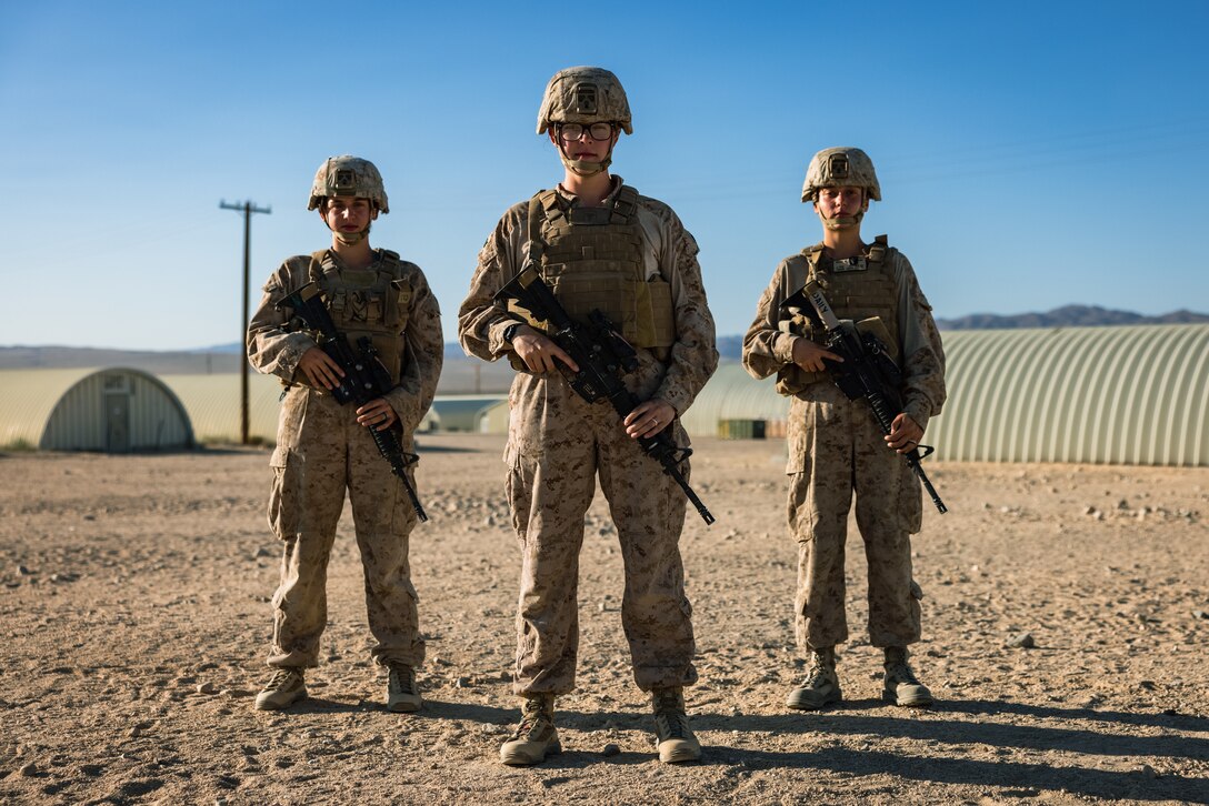 U.S. Navy Hospital Corpsman 2nd Class Kelli Oldham, center, a native of Pocatello, Idaho, and a Corpsman with 2nd Medical Battalion, 2nd Marine Logistics Group, poses for a photo alongside her fellow corpsman on Marine Corps Air Ground Combat Center Twentynine Palms, California, Aug. 19, 2024. Oldham’s command selected her as Warrior of the Week due to her expertise during Service Level Training Exercise 5-24, where she filled the role of Medical Regulator for the exercise, tracking 325 simulated casualties from point of injury to definitive care with zero discrepancies. When asked how she felt about being selected as Warrior of the Week she said, “I’m super grateful to work with such a wonderful team of doctors, nurses and corpsman, and I’m honored to be selected to represent everything we accomplished here (in Twentynine Palms).”  Each week, 2nd MLG recognizes one outstanding Marine or Sailor that goes above and beyond in their duties and embodies the qualities of an outstanding service member. (U.S. Marine Corps photo by Cpl. Alexis Sanchez)