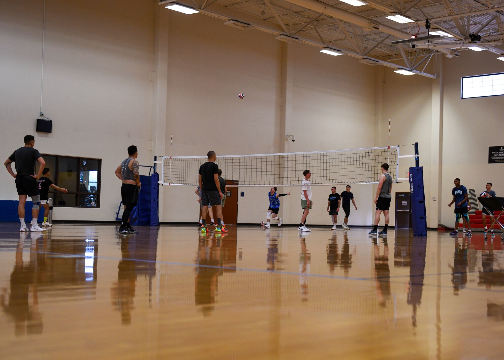 Men warm up prior to volleyball practice.