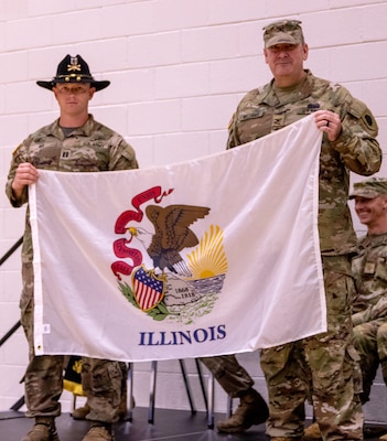 Col. (P) Lenny Williams, the Assistant Adjutant General – Army, and Commander of the Illinois Army National Guard, presents Capt. Andrew Mix, commander, Troop A, 2nd Squadron, 106th Cavalry Regiment, with a State of Illinois flag to carry with them on their deployment to the U.S. Africa Command area of responsibility.