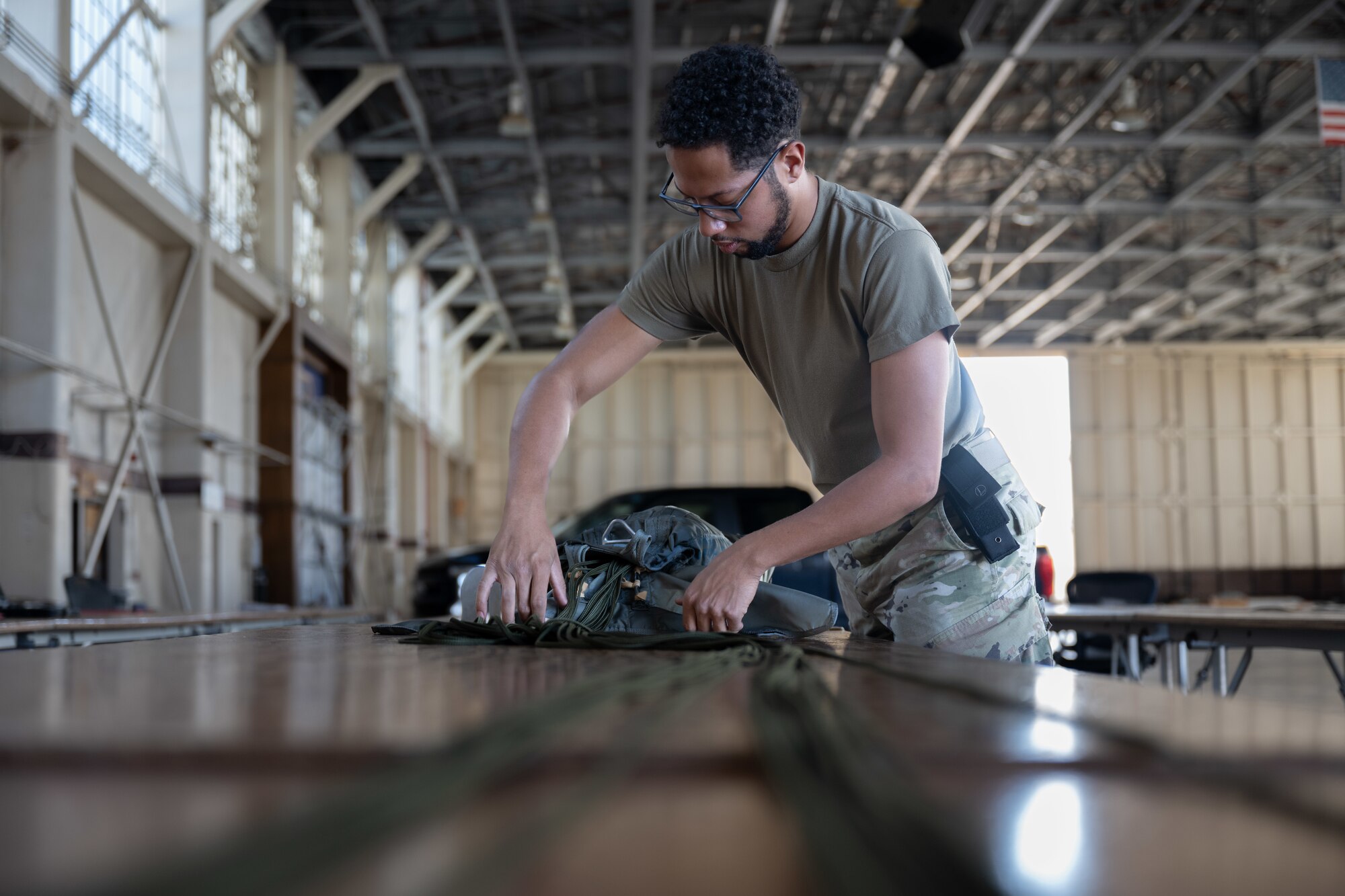 Airman prepares a parachute for future use.