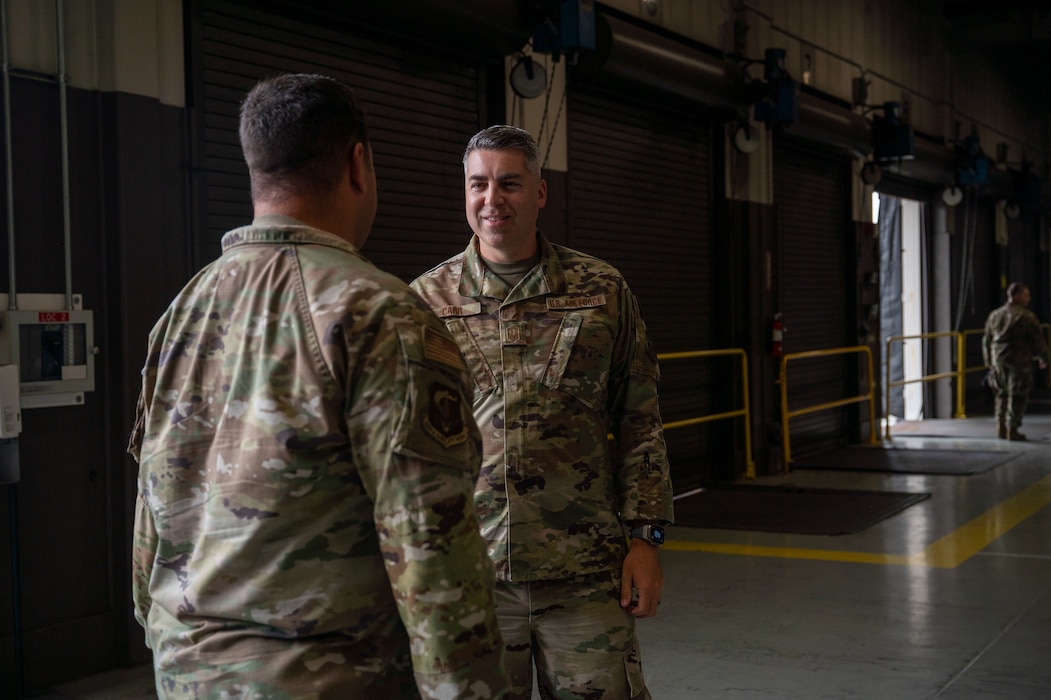 Senior Master Sgt. Justin Carr, 86th Aerial Port Squadron flight chief, meets with Col. Joseph Vanoni, 446th Airlift Wing commander, during his visit to the 86th APS on Sept. 8, 2024, at Joint Base Lewis-McChord, Washington.