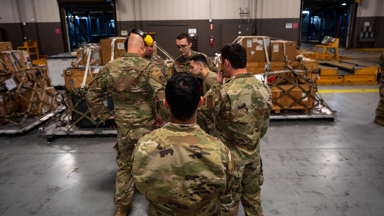 Members of  the 86th Aerial Port Squadron make plans for a cargo move on Sept. 8, 2024, at Joint Base Lewis-McChord, Washington.