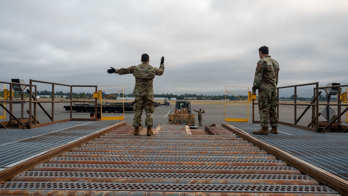 Members of the 86th Aerial Port Squadron move cargo on Sept. 8, 2024, at Joint Base Lewis-McChord, Washington.