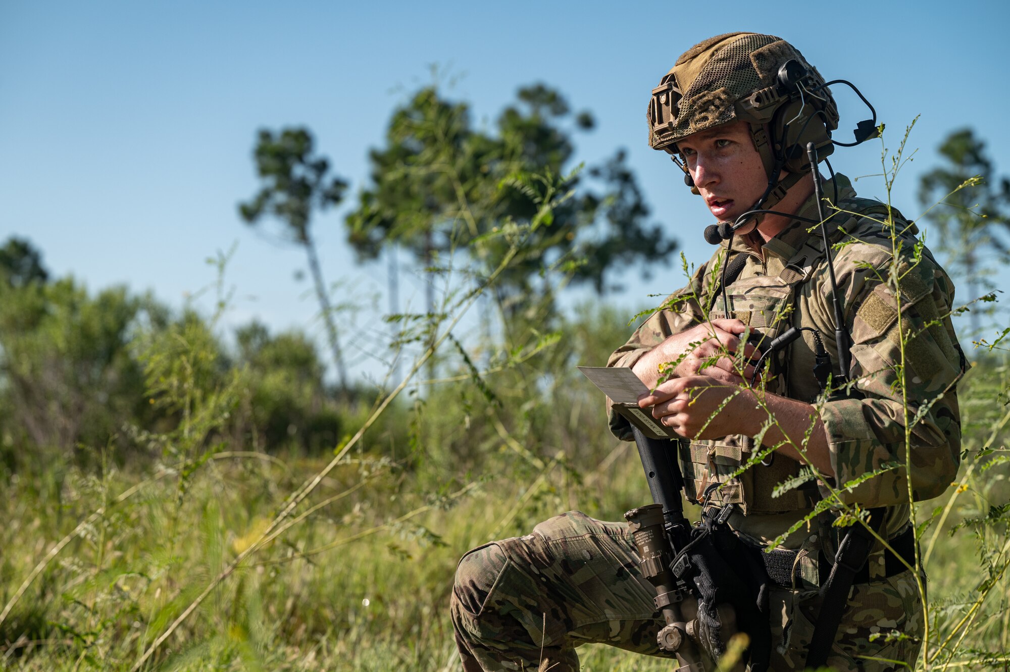An airman calls in a medical evacuation